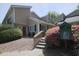Inviting townhouse showcasing a well-maintained exterior with a stone walkway, manicured shrubs, and a pet waste station at 1468 Briarwood Ne Rd # 703, Atlanta, GA 30319