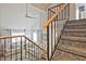 Bright living room showcasing stairs, a vaulted ceiling, and comfortable seating area at 1468 Briarwood Ne Rd # 703, Atlanta, GA 30319