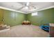 Finished basement with green painted walls, a play table, and a trampoline; large, versatile basement space at 2784 Sixes Rd, Canton, GA 30114