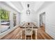 Formal dining room featuring decorative crown molding, large windows, and modern lighting at 2784 Sixes Rd, Canton, GA 30114