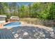 The in-ground pool is surrounded by a patio and wooden deck, perfect for relaxation at 2784 Sixes Rd, Canton, GA 30114