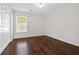 Bedroom with large closet, neutral paint, and wood floors at 2990 Williams Farm Dr, Dacula, GA 30019