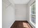 Walk-in closet with shelving and window providing natural light at 2990 Williams Farm Dr, Dacula, GA 30019
