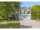 Charming two-story home with a two car garage and stone facade detail at 2990 Williams Farm Dr, Dacula, GA 30019