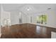 Bright living room featuring hardwood floors and large windows for natural light at 2990 Williams Farm Dr, Dacula, GA 30019