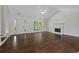Spacious and airy living room featuring hardwood floors and a fireplace at 2990 Williams Farm Dr, Dacula, GA 30019