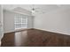 Large main bedroom with beautiful tray ceilings and dark wood flooring at 2990 Williams Farm Dr, Dacula, GA 30019