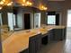 Bathroom featuring double sinks, vanity with lots of cabinets, large mirrors, and tile floors at 5679 Coopers Glen Ct, Mableton, GA 30126