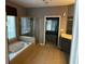 Bright bathroom featuring a soaking tub, glass-enclosed shower, and double vanity at 5679 Coopers Glen Ct, Mableton, GA 30126