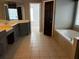 Bathroom with a soaking tub, a tiled floor, a vanity and enclosed glass shower at 5679 Coopers Glen Ct, Mableton, GA 30126