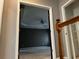 Bedroom doorway with a ceiling fan, tray ceiling, and neutral-toned walls visible from the hallway at 5679 Coopers Glen Ct, Mableton, GA 30126
