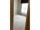 Comfortable bedroom featuring a neutral color scheme, carpeted floor, and a large window at 5679 Coopers Glen Ct, Mableton, GA 30126