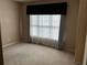 Cozy bedroom featuring a neutral color scheme, carpeted floor, and ample natural light at 5679 Coopers Glen Ct, Mableton, GA 30126