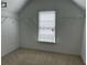 Walk-in closet with carpet floors, open shelving, and a window with blinds at 5679 Coopers Glen Ct, Mableton, GA 30126
