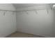 Walk-in closet with carpet floors and open shelving at 5679 Coopers Glen Ct, Mableton, GA 30126