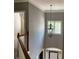 Elegant foyer with a decorative chandelier and natural light streaming through a window at 5679 Coopers Glen Ct, Mableton, GA 30126