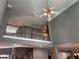 Second floor foyer with railing overlooking the living room, offering a view into the kitchen at 5679 Coopers Glen Ct, Mableton, GA 30126