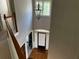 Open foyer with wood floor and stairs with decorative railings at 5679 Coopers Glen Ct, Mableton, GA 30126
