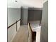 Upstairs hallway with decorative railings, neutral paint and carpet at 5679 Coopers Glen Ct, Mableton, GA 30126