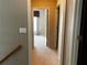 Hallway leads to a bedroom with natural light at 5679 Coopers Glen Ct, Mableton, GA 30126