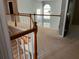 Hallway area with view of downstairs living area with fan and stairs at 5679 Coopers Glen Ct, Mableton, GA 30126
