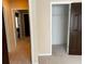 Hallway featuring neutral walls, carpet floors, and doors leading to other rooms at 5679 Coopers Glen Ct, Mableton, GA 30126