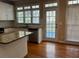 Bright kitchen featuring granite countertops, stainless steel appliances, and hardwood floors at 5679 Coopers Glen Ct, Mableton, GA 30126