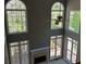 Spacious living room with fireplace and lots of natural light at 5679 Coopers Glen Ct, Mableton, GA 30126