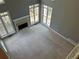 Spacious living room with fireplace and lots of natural light at 5679 Coopers Glen Ct, Mableton, GA 30126