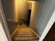 View looking down carpeted stairs with gray walls and white trim at 5679 Coopers Glen Ct, Mableton, GA 30126