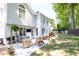 Spacious backyard with patio, outdoor seating, grill, and well-manicured lawn, ideal for entertaining at 11140 Brookhollow Trl, Alpharetta, GA 30022