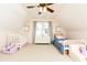 Spacious bedroom with vaulted ceilings, two beds, a dresser, and plush carpet in a light pink tone at 11140 Brookhollow Trl, Alpharetta, GA 30022