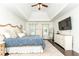Bright primary bedroom features neutral walls, dark floors, stylish decor, and a large window for natural light at 11140 Brookhollow Trl, Alpharetta, GA 30022