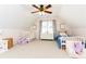 Bedroom with twin beds and dresser in a light tone and a large window with pink walls at 11140 Brookhollow Trl, Alpharetta, GA 30022