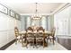 Dining room with table and chairs adjacent to entrance, and hardwood floors at 11140 Brookhollow Trl, Alpharetta, GA 30022