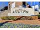 Entrance sign for the Avalon community with planted flowers at 11140 Brookhollow Trl, Alpharetta, GA 30022