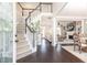 Inviting foyer with hardwood floors, staircase, and an open view to the living room at 11140 Brookhollow Trl, Alpharetta, GA 30022