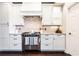 Stylish kitchen featuring stainless steel appliances, custom cabinetry, and granite countertops at 11140 Brookhollow Trl, Alpharetta, GA 30022
