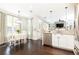 Open concept kitchen featuring stainless steel appliances, granite countertops, and a dining area at 11140 Brookhollow Trl, Alpharetta, GA 30022