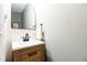 Chic powder room with a modern vanity, stylish faucet, and elegant mirror at 11140 Brookhollow Trl, Alpharetta, GA 30022
