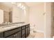 Bathroom featuring a double vanity with granite countertop and tile flooring at 1780 Morningtide Ne Ln, Atlanta, GA 30324
