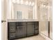 Main bathroom featuring a granite countertop double vanity and walk-in shower at 1780 Morningtide Ne Ln, Atlanta, GA 30324