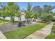 Community outdoor seating area with gravel, grass, and seating at 1780 Morningtide Ne Ln, Atlanta, GA 30324