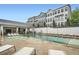 Beautiful community pool with lounge chairs and covered seating area at new townhouse complex at 1780 Morningtide Ne Ln, Atlanta, GA 30324