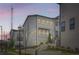 Beautiful townhome with landscaped front yard and charming curb appeal, featuring white siding and brick accents at 1780 Morningtide Ne Ln, Atlanta, GA 30324