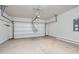 Spacious two-car garage with concrete floor and automatic door at 1780 Morningtide Ne Ln, Atlanta, GA 30324