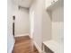 Hallway with hardwood flooring and built-in shelving with bench at 1780 Morningtide Ne Ln, Atlanta, GA 30324