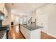 Modern kitchen featuring granite countertops, stainless steel appliances, open layout and view to living room at 1780 Morningtide Ne Ln, Atlanta, GA 30324