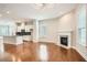 Open-concept living space featuring a modern kitchen, fireplace, and hardwood floors at 1780 Morningtide Ne Ln, Atlanta, GA 30324
