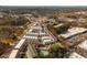 Aerial view of modern townhomes showcasing architectural details and community layout with a pool at 472 Burton Dr, Alpharetta, GA 30009